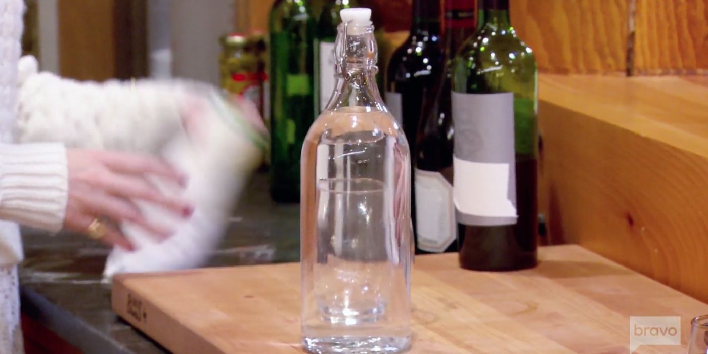 An image of water in a glass bottle on RHONY