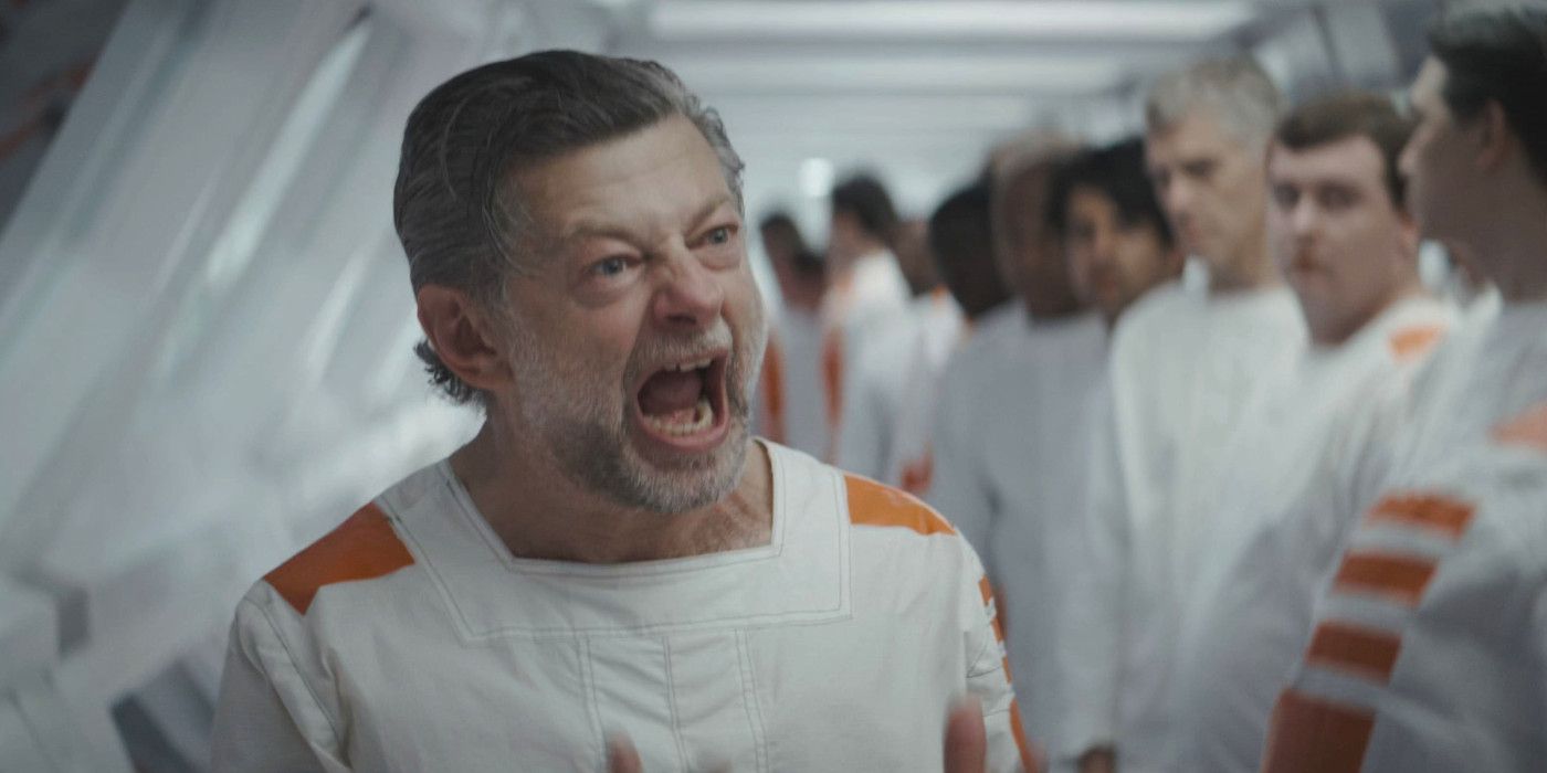 Andy Serkis yelling at other men in a corridor in Andor