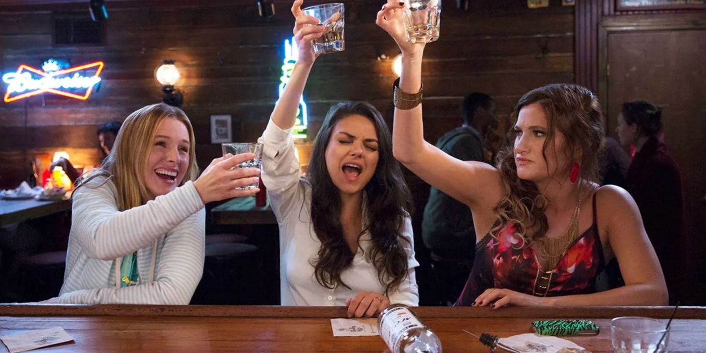 Kiki, Amy, and Carla cheering at a bar in Bad Moms Christmas. 