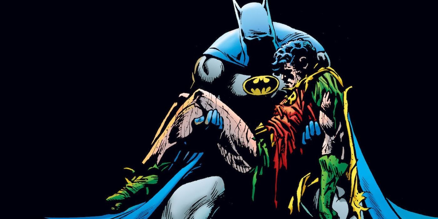  Batman with Robin Jason Todd in his arms on the cover of Death of the Family.