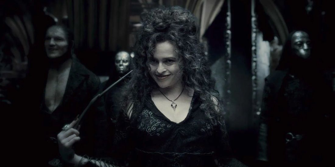 Bellatrix Lestrange holding her wand and smiling at Harry Potter. 