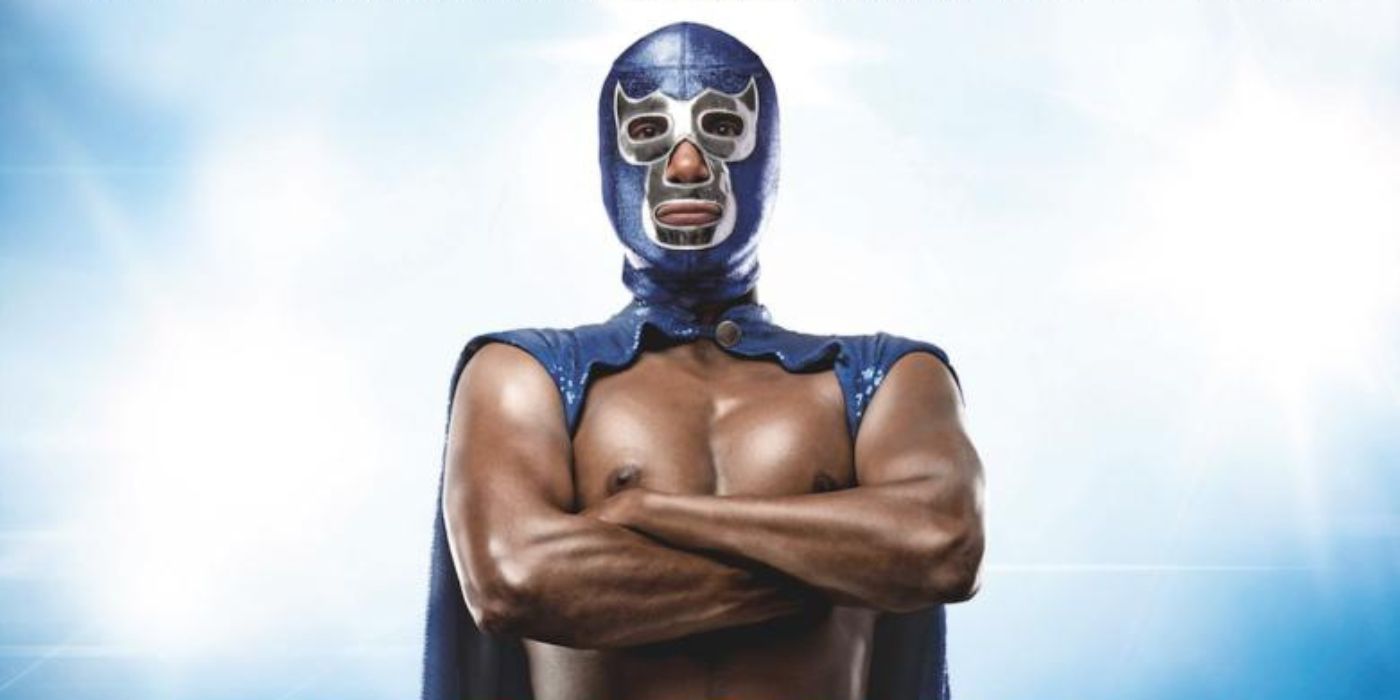 Blue Demon standing with his arms crossed