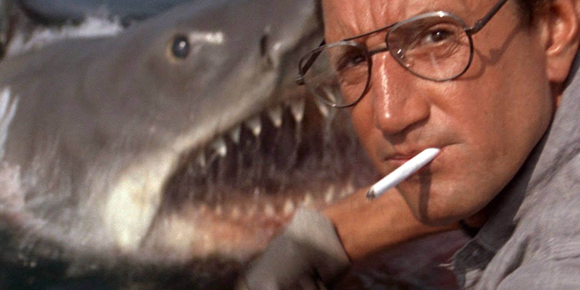 Brody with a shark behind him in Jaws