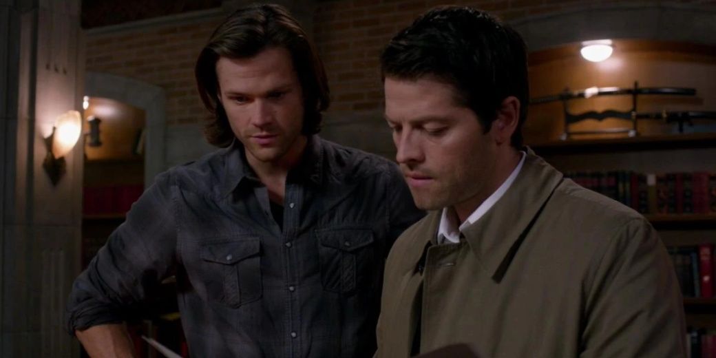 Castiel and Sam read a book in Supernatural