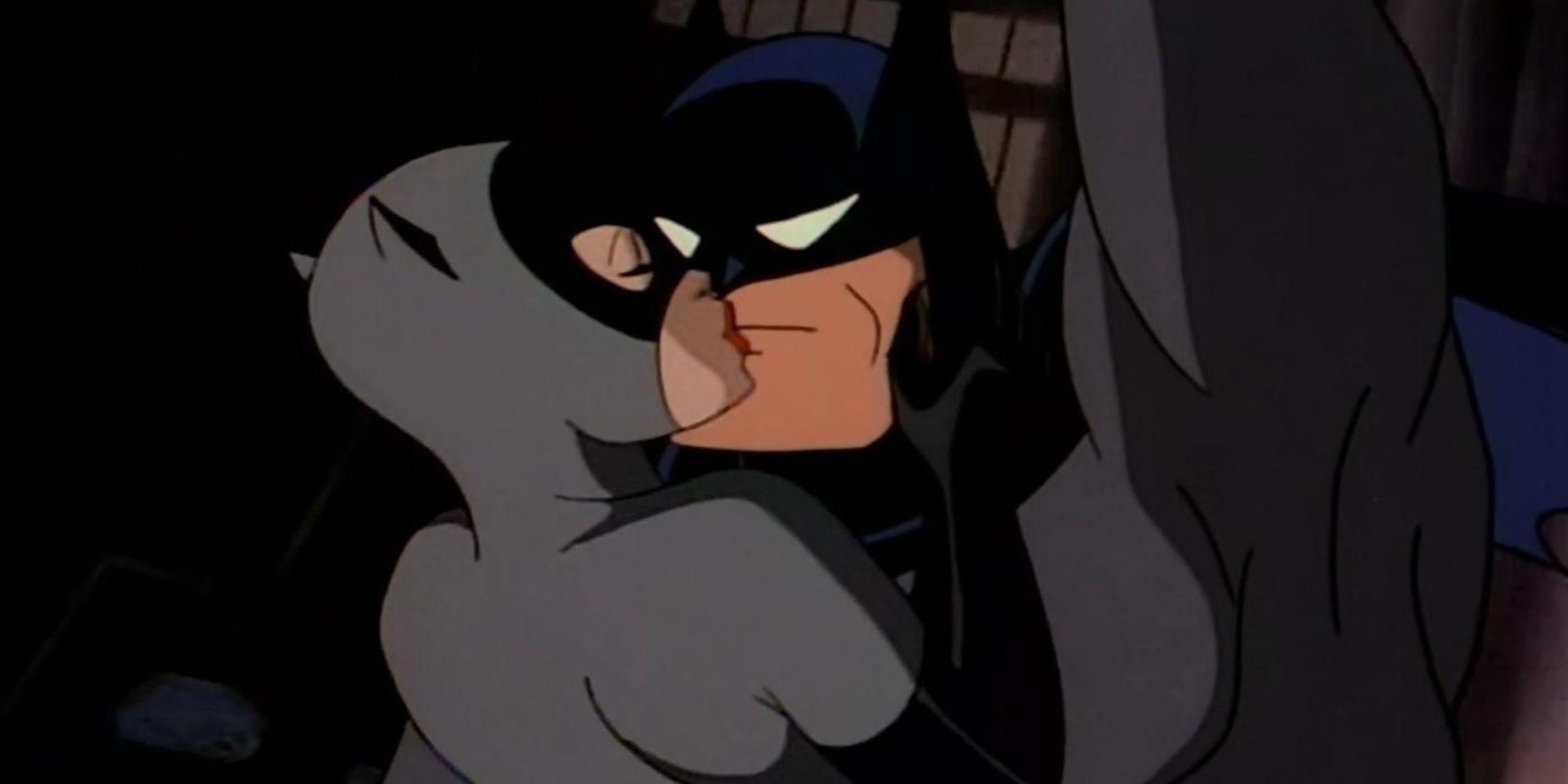 Mulher-Gato dando um beijo em Batman enquanto balança em Gotham em Batman The Animated Series