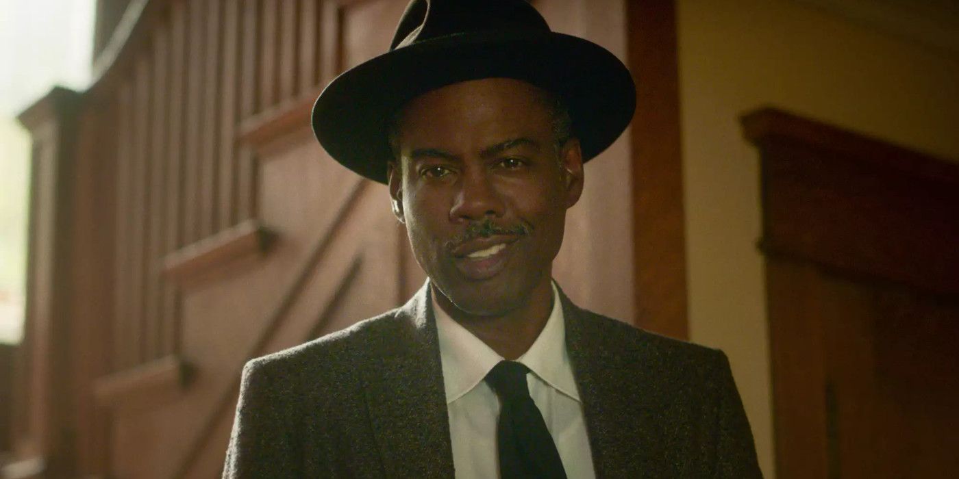 Chris Rock in Fargo season 4 wearing a hat and suit and smirking with self-satisfaction