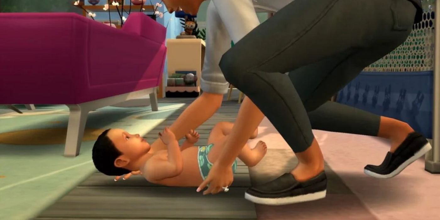 An adult playing with an infant in The Sims 4
