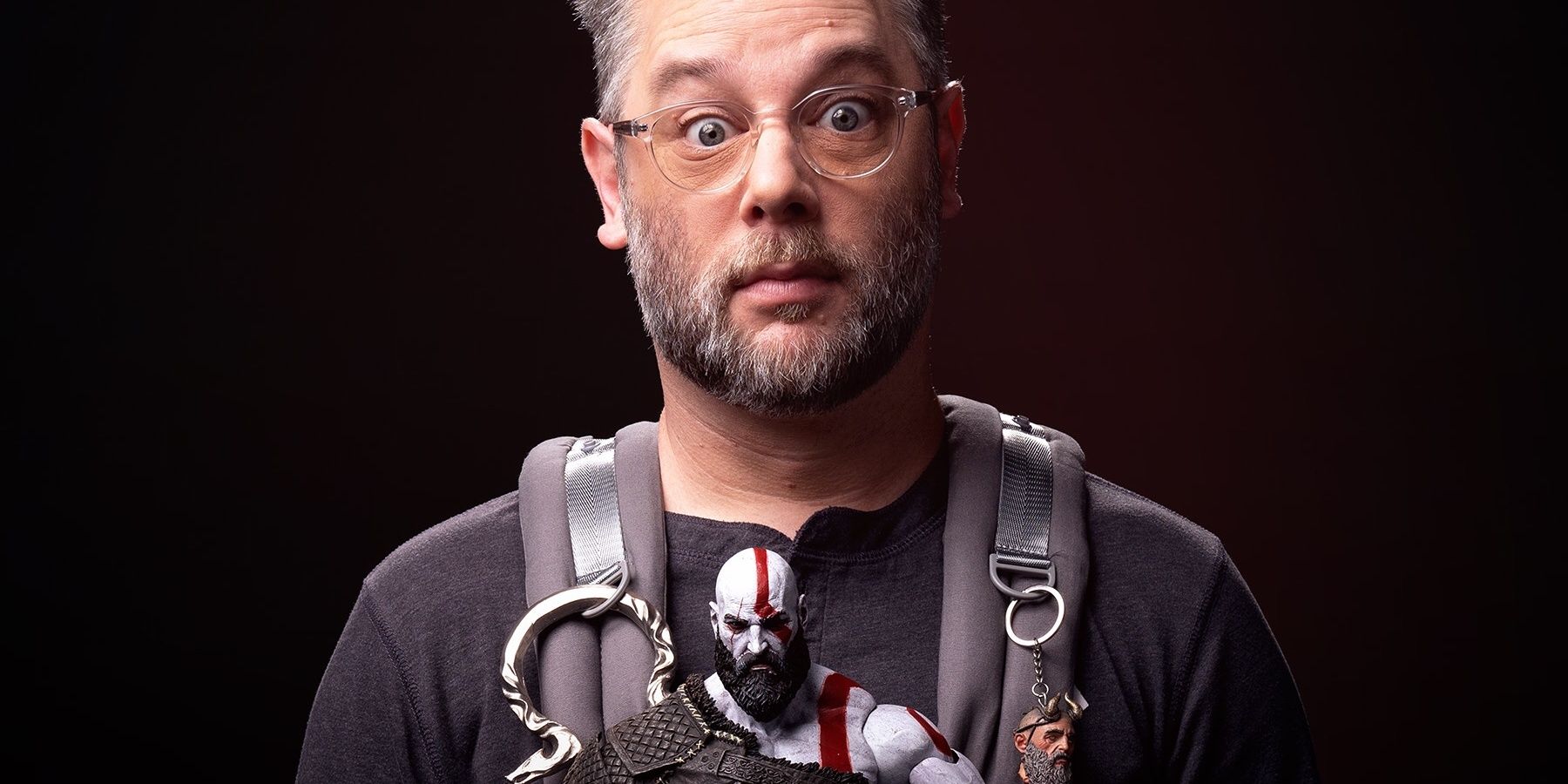 Cory Barlog holding Kratos on the poster for the Raising Kratos God of War documentary