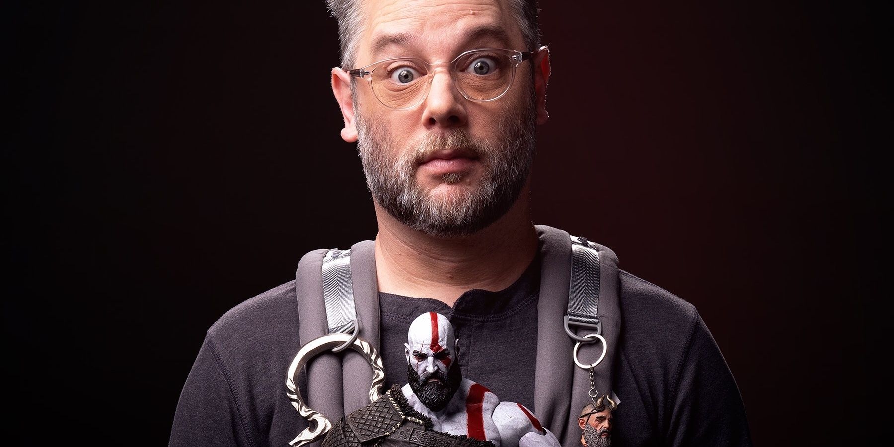 Cory Barlog carrying Kratos on the poster for Raising Kratos God of War documentary