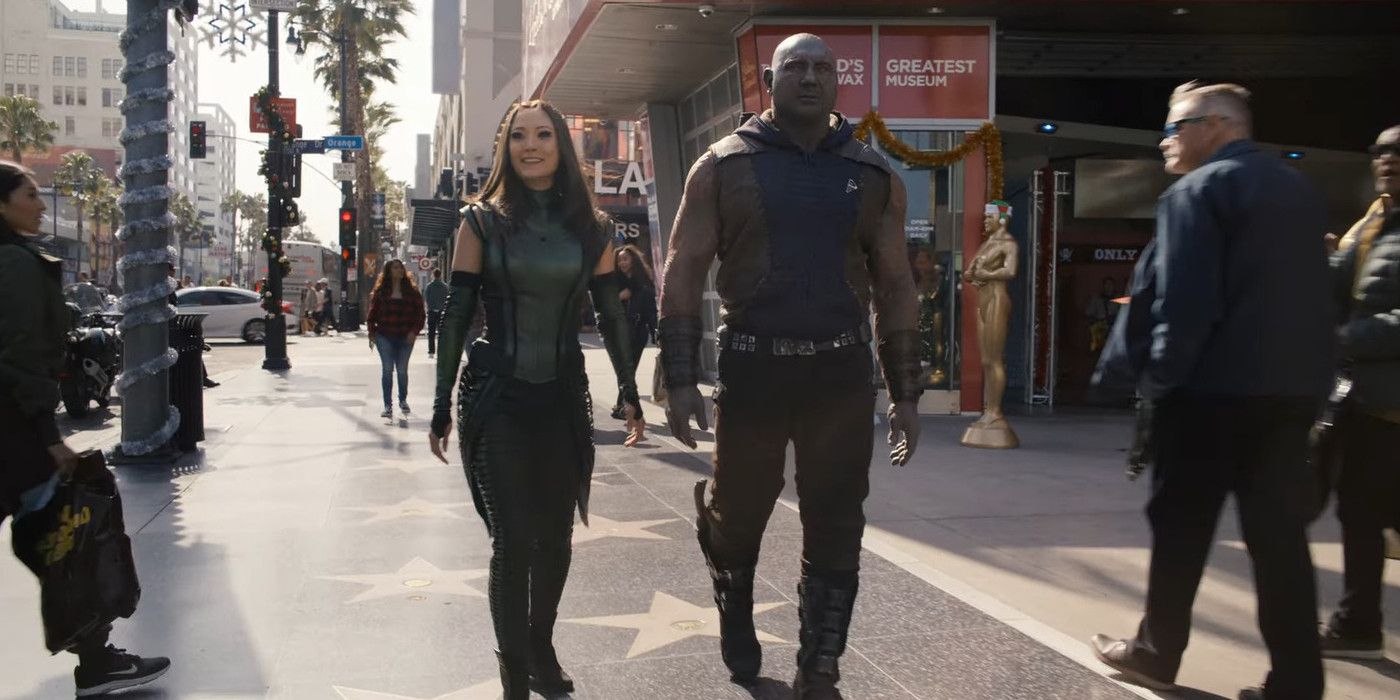 Drax and Mantis walking along the sidewalk in The Guardians of the Galaxy Holiday Special.