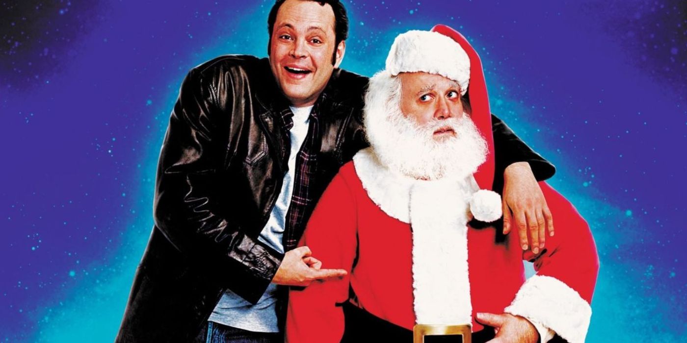 Fred em pé com seu irmão Papai Noel apontando para ele em Fred Claus. 