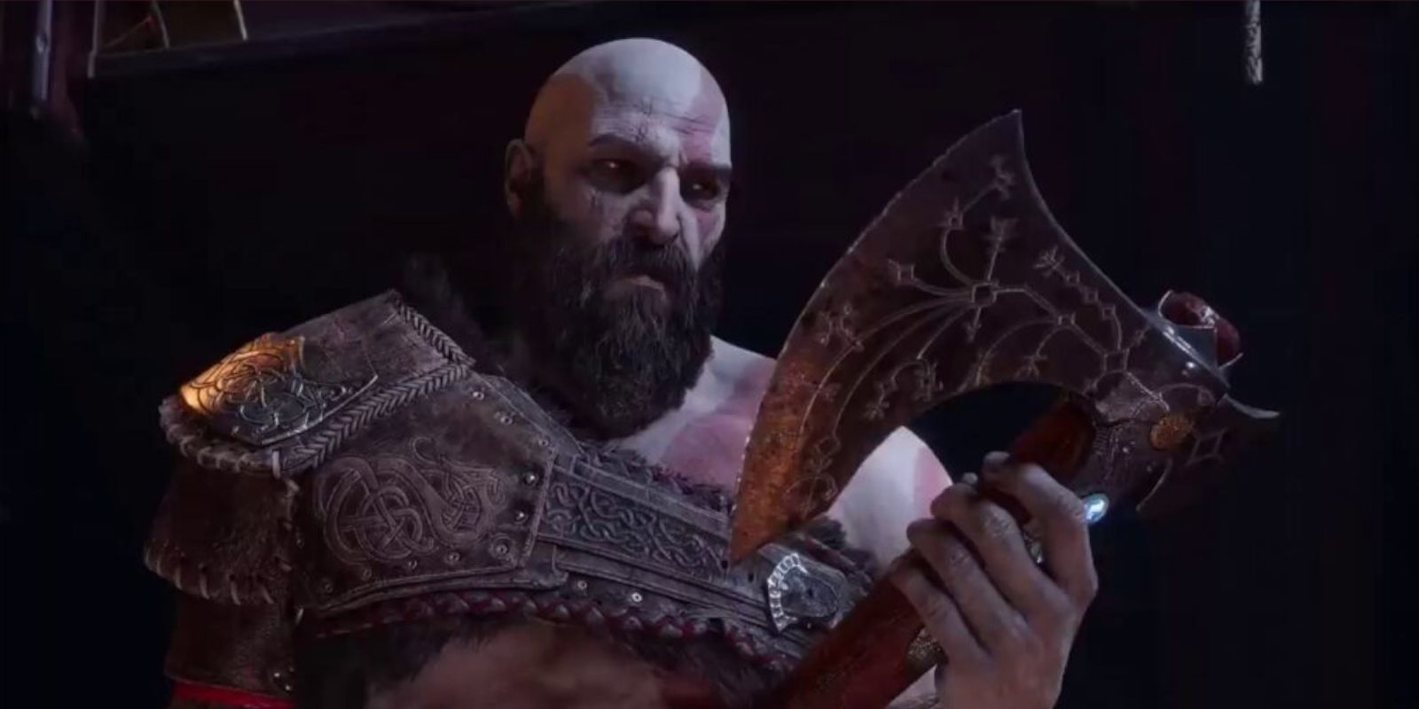 Kratos looking at the Leviathan ax in God of War.