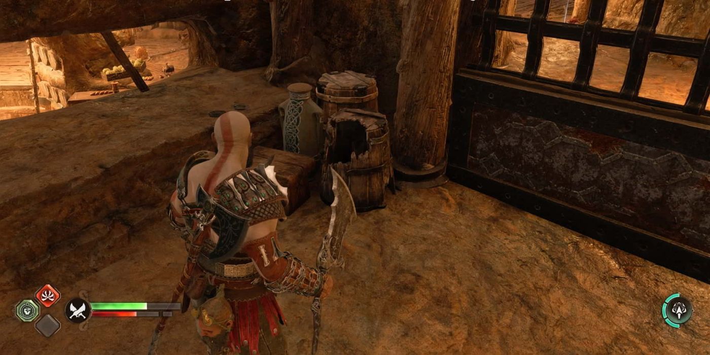 Kratos in front of barrels and pots in god of war ragnarok.