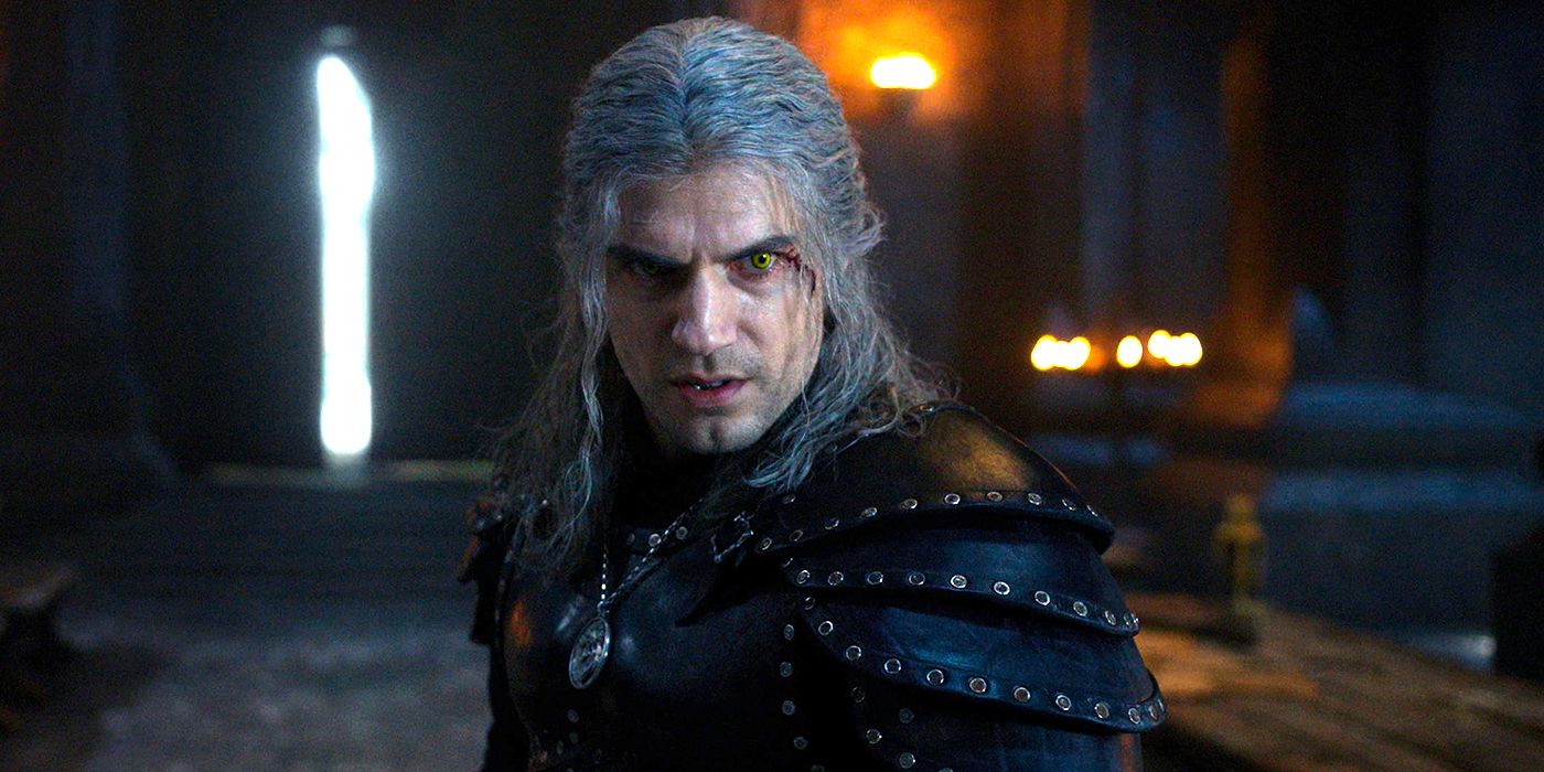 Geralt with wounds on his face and glowing eyes looking fierce in The Witcher.