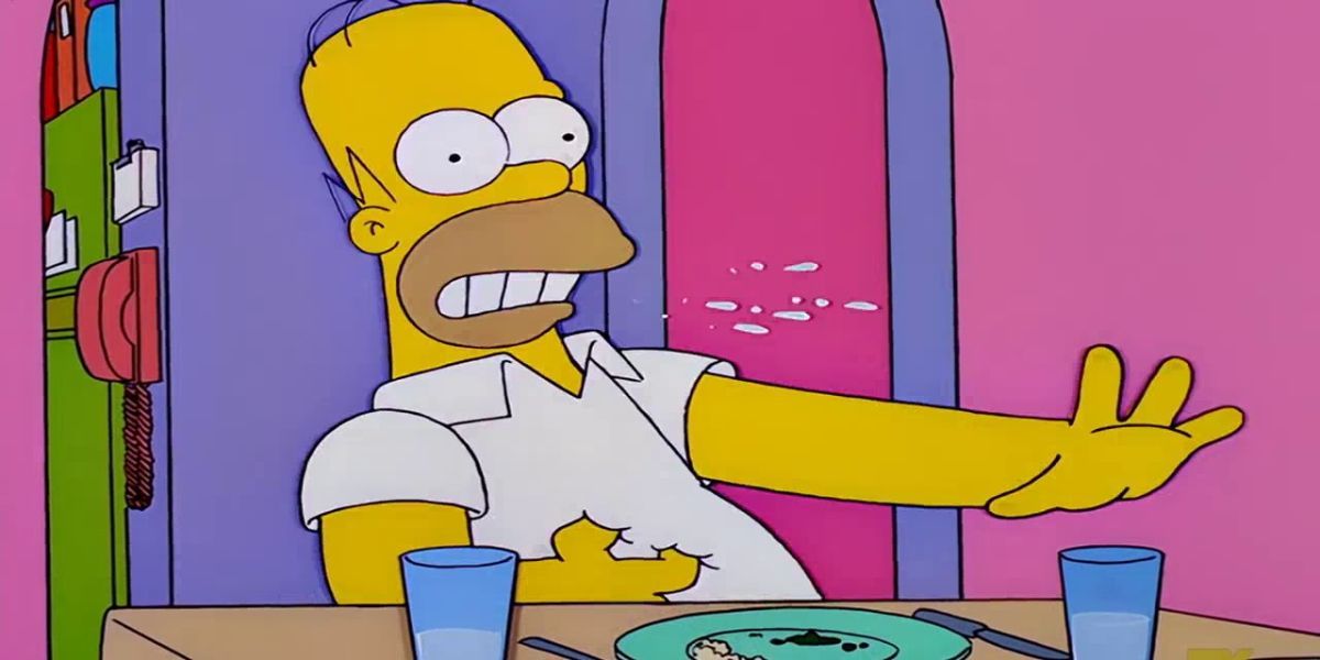 Homer Simpson na mesa de jantar ofegando e segurando o estômago