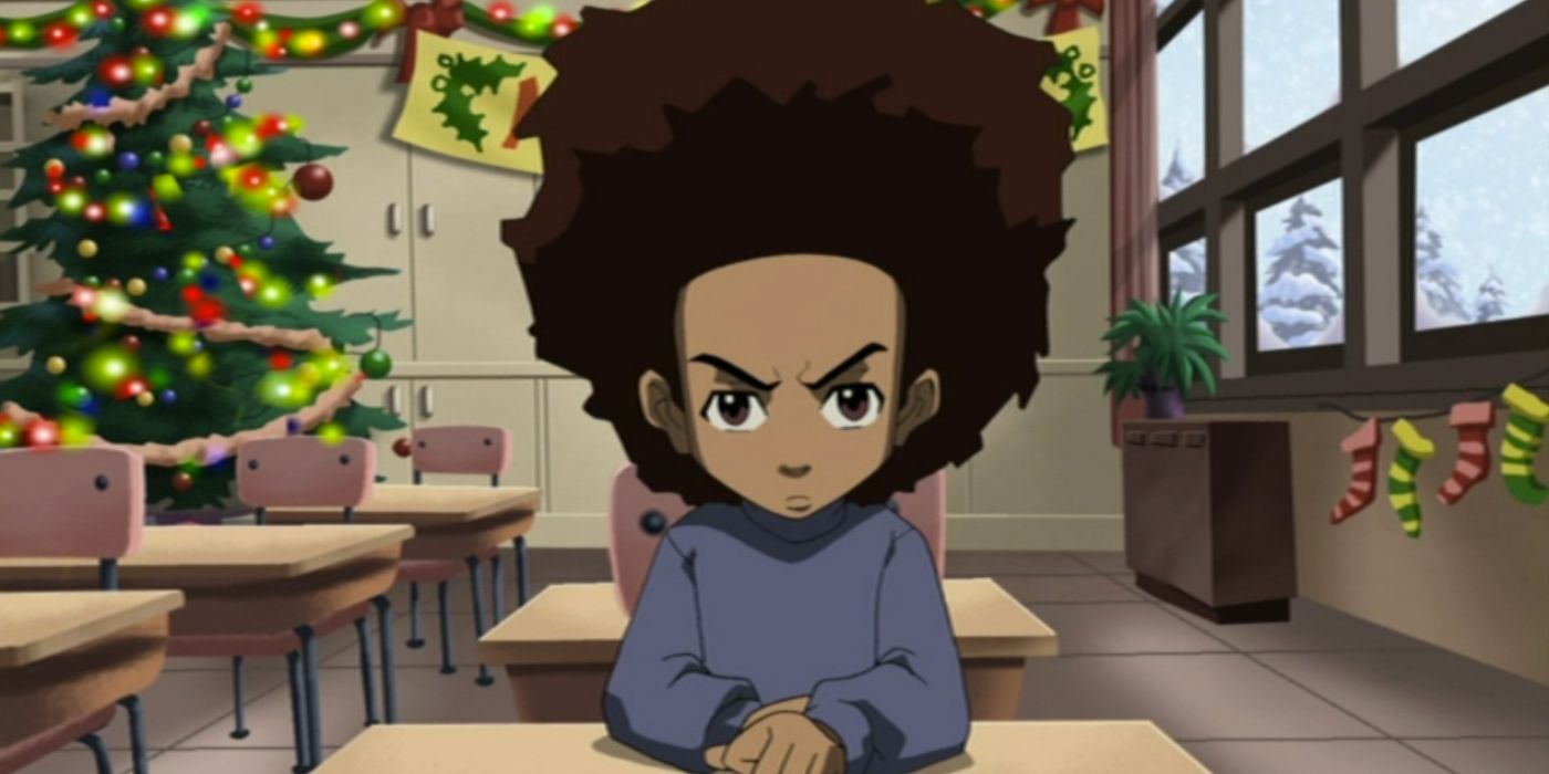 Huey sitting in his classroom with a Christmas tree behind him in The Boondocks Christmas special. 