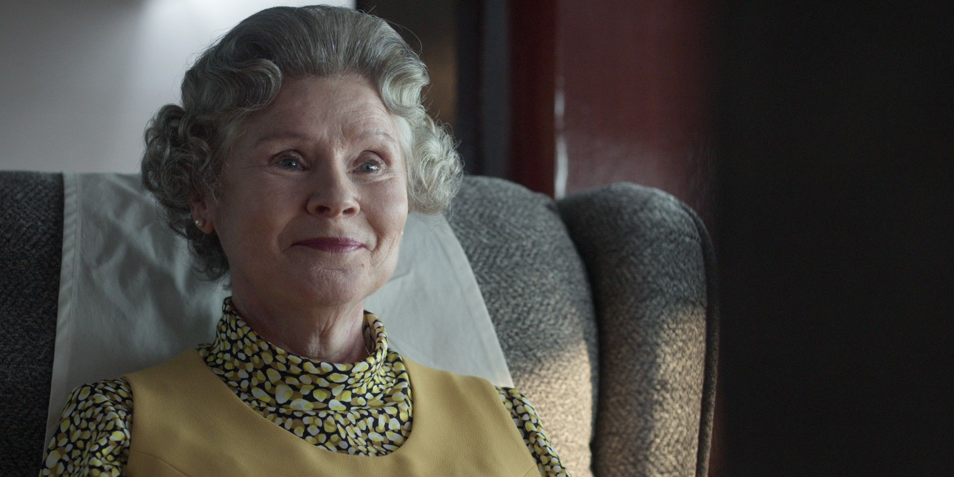 Queen Elizabeth II smiling widely in The Crown season 5