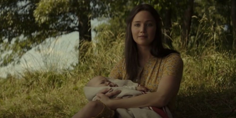 Katniss Everdeen holding her baby in The Hunger Games Mockingjay