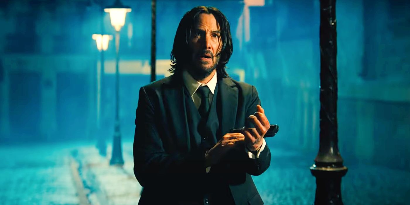 Keanu Reeves checking his watch in John Wick Chapter 4.