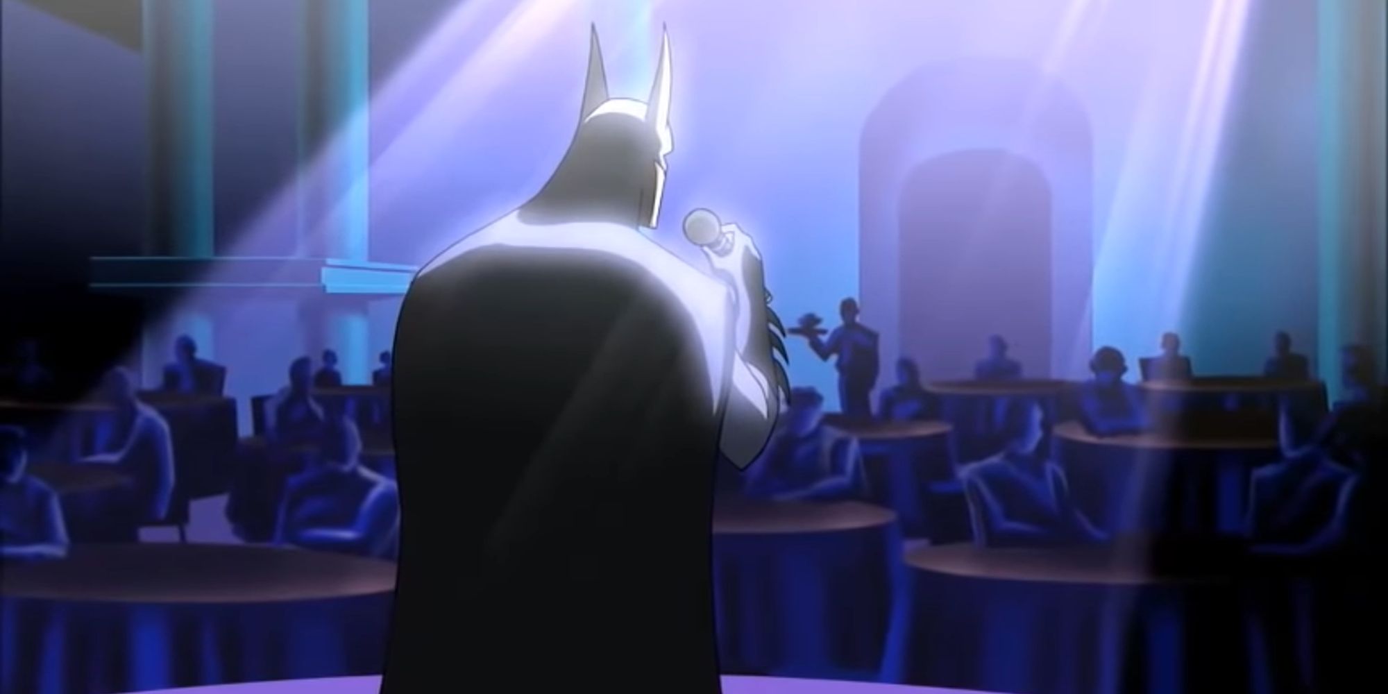 Kevin Conroy's Batman singing before a live audience in Justice League Unlimited