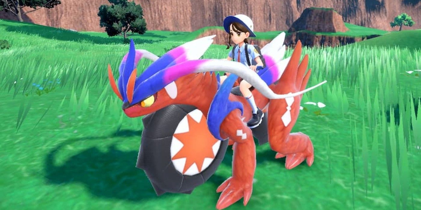 A character riding Koraidon​​​​​​​​​​​​​​ in Pokémon Scarlet and Violet
