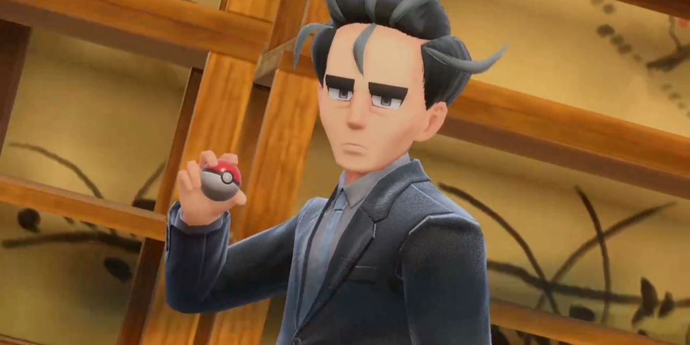 Larry sosteniendo una Pokébola y luciendo serio en Pokémon Escarlata y Violeta