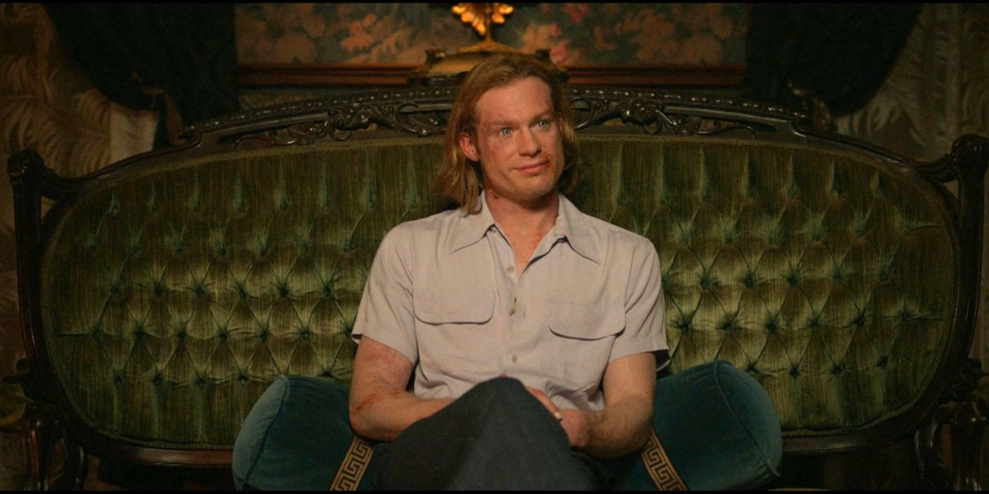 Lestat In Interview With The Vampire Episode 6 sitting on a sofa with a bloodied face