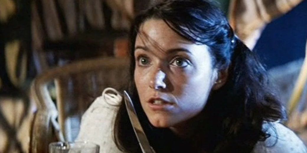 Marion with a knife in Raiders of the Lost Ark