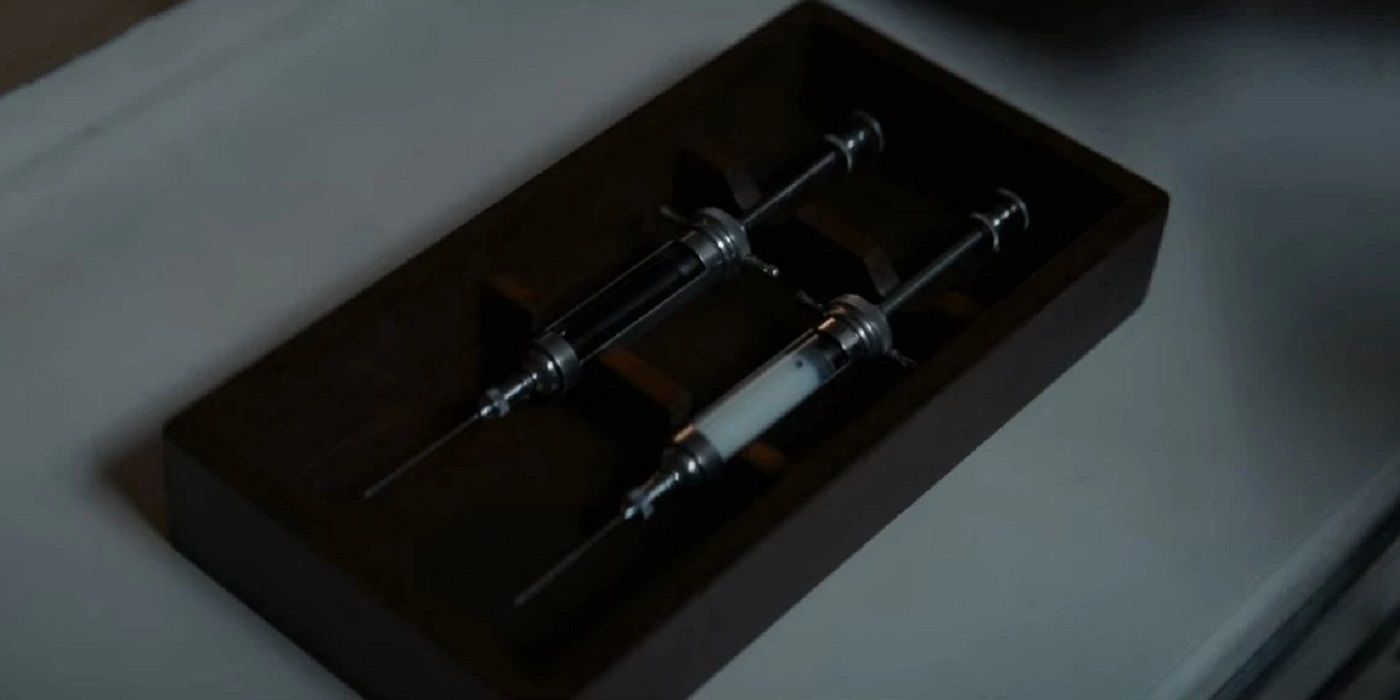 Two syringes sit on a table in 1899