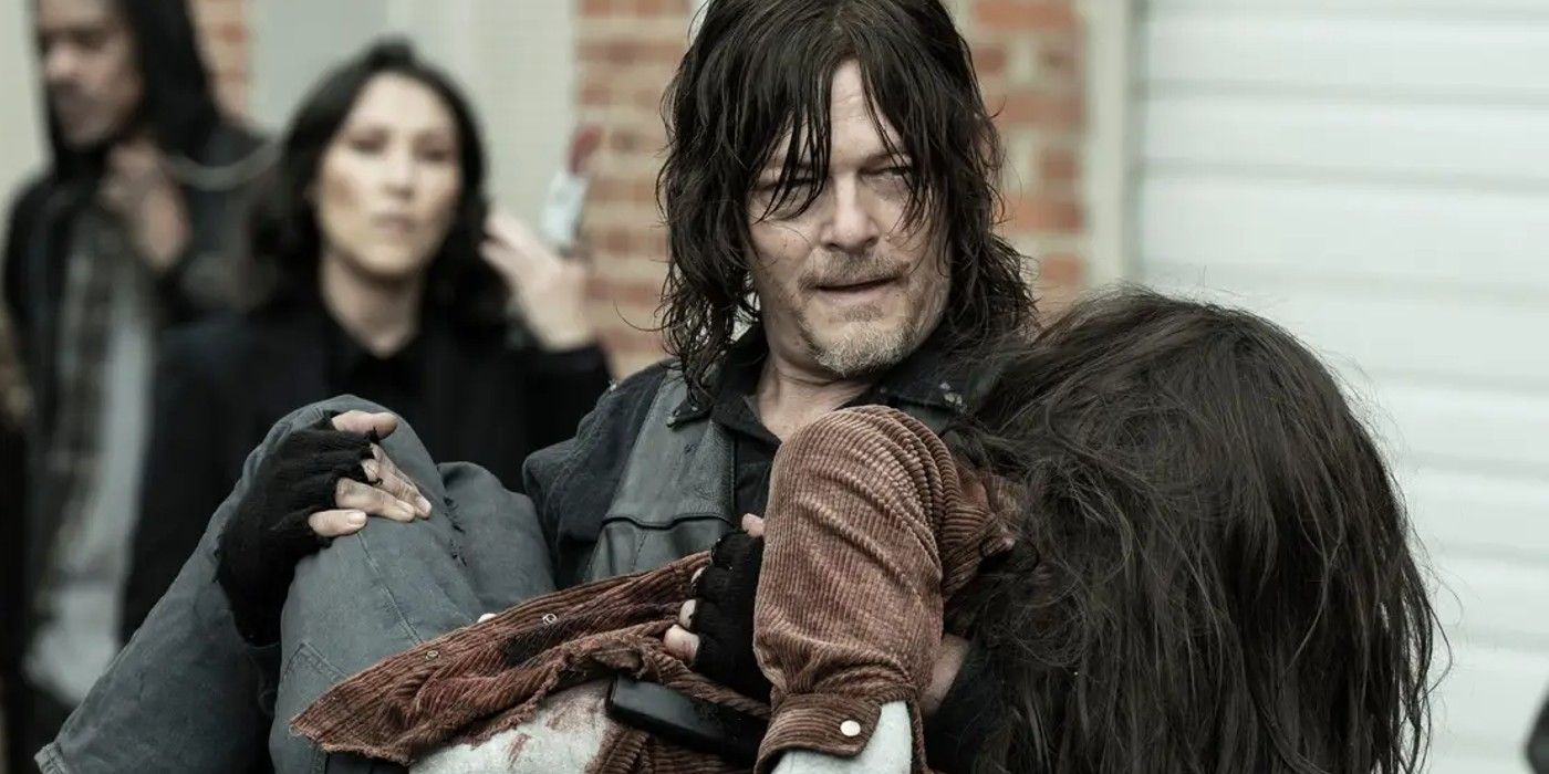 Norman Reedus as Daryl carrying Judith in Walking Dead