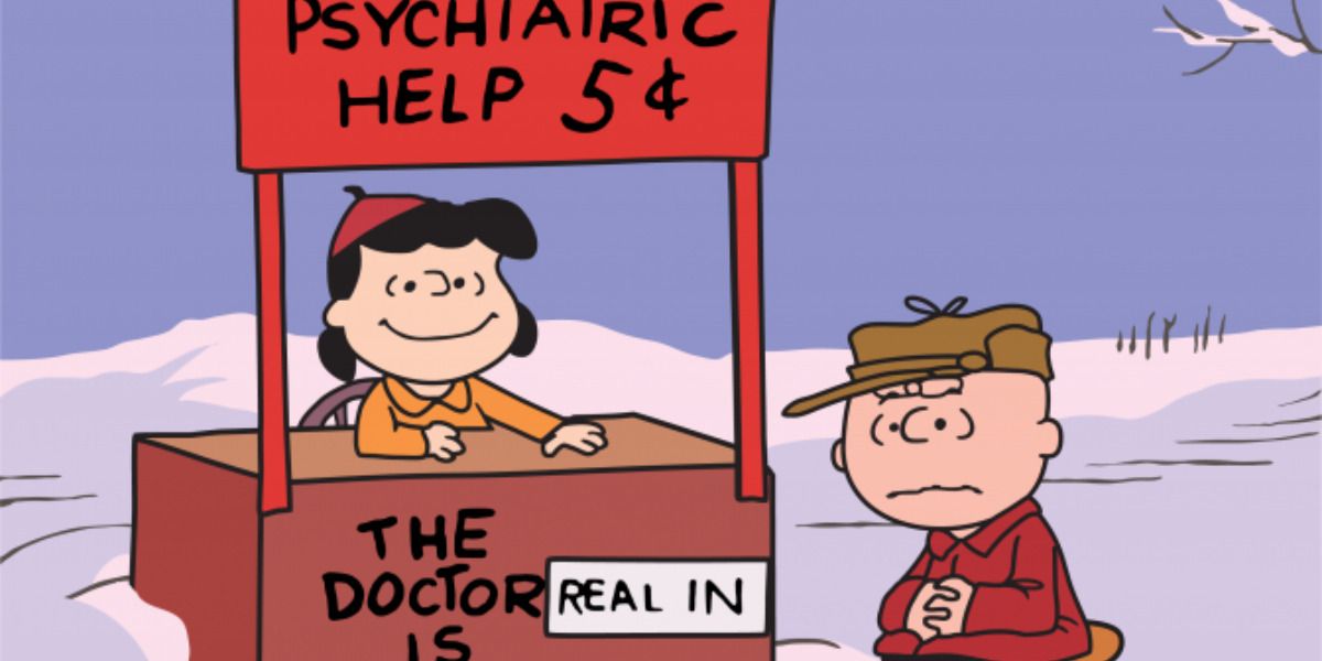 An image of Lucy at her Psych booth with Charlie Brown is shown.