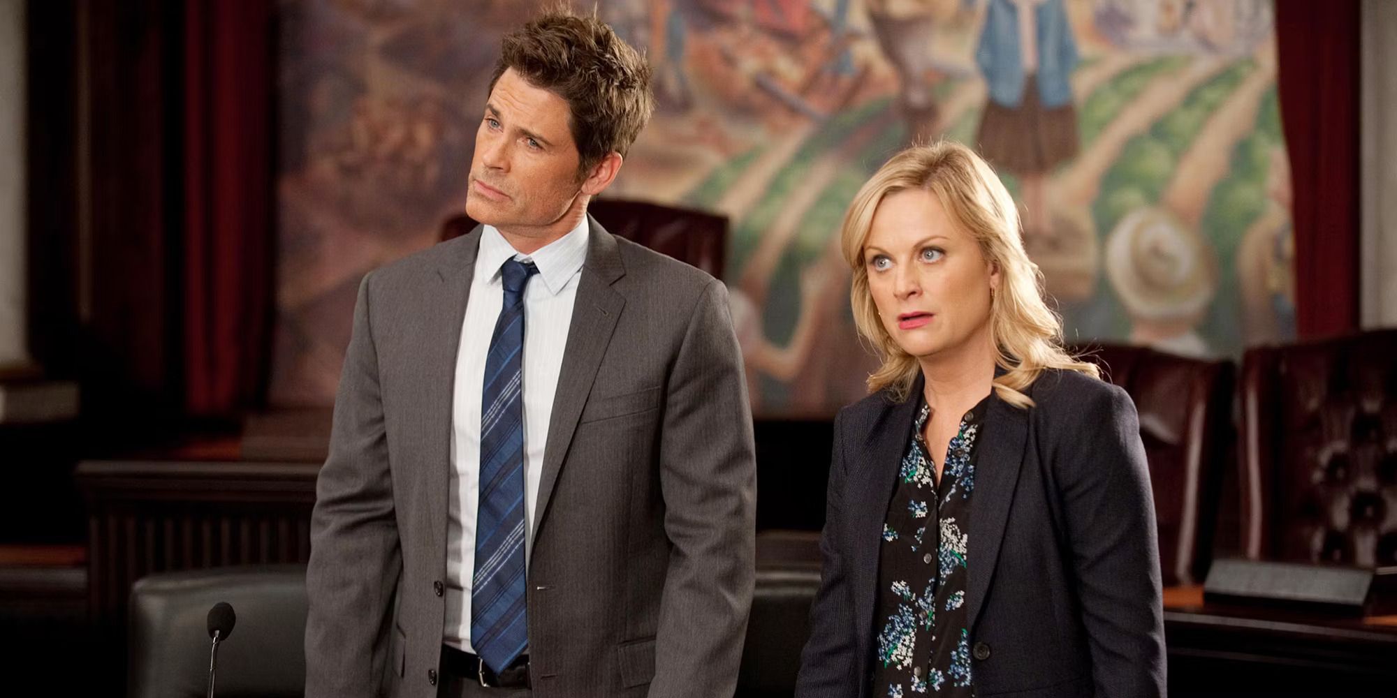 Rob Lowe as Chris Traeger and Amy Poehler as Leslie Knope in Parks And Recreation
