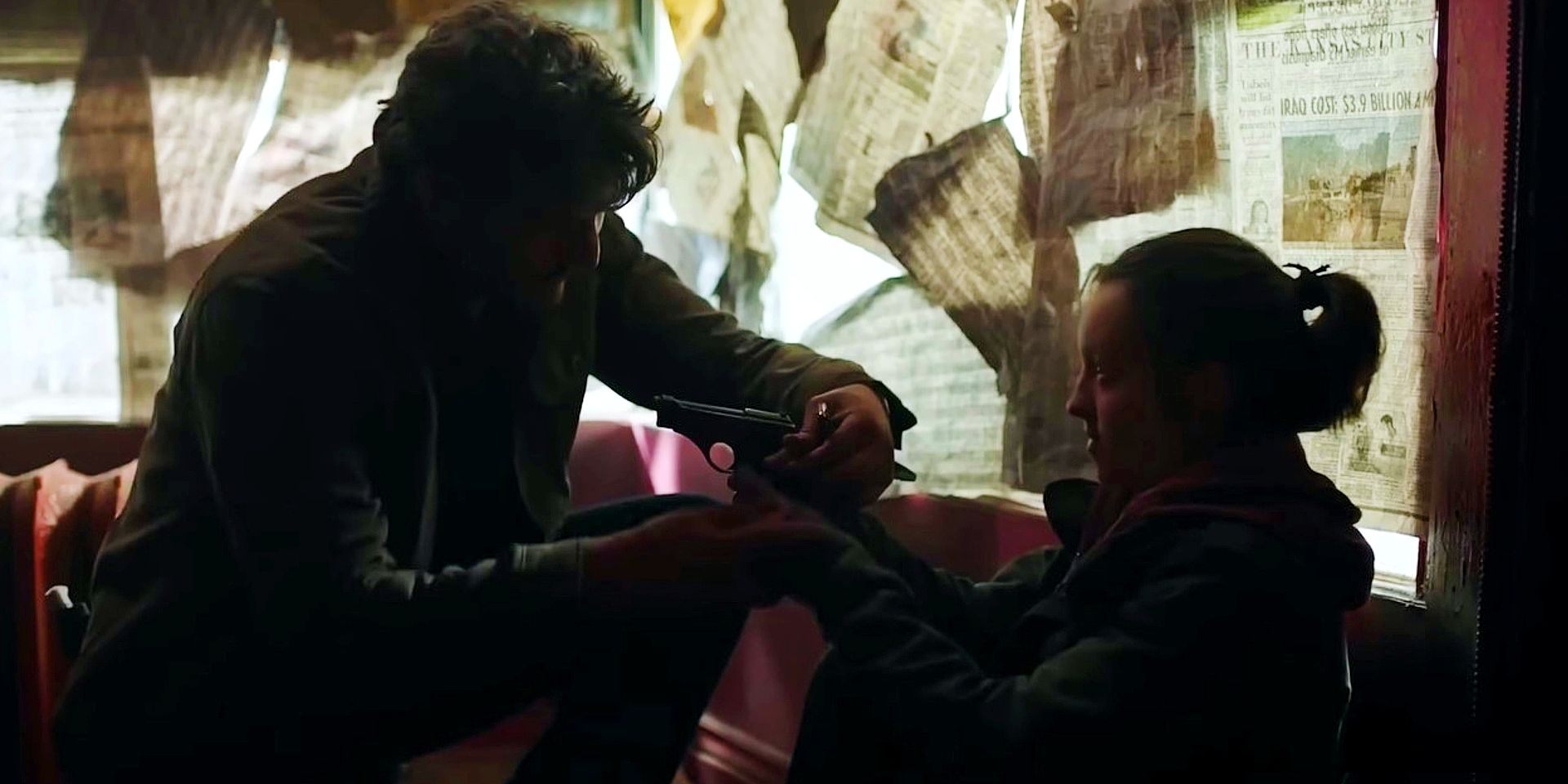 Joel handing Ellie a gun in The Last of Us
