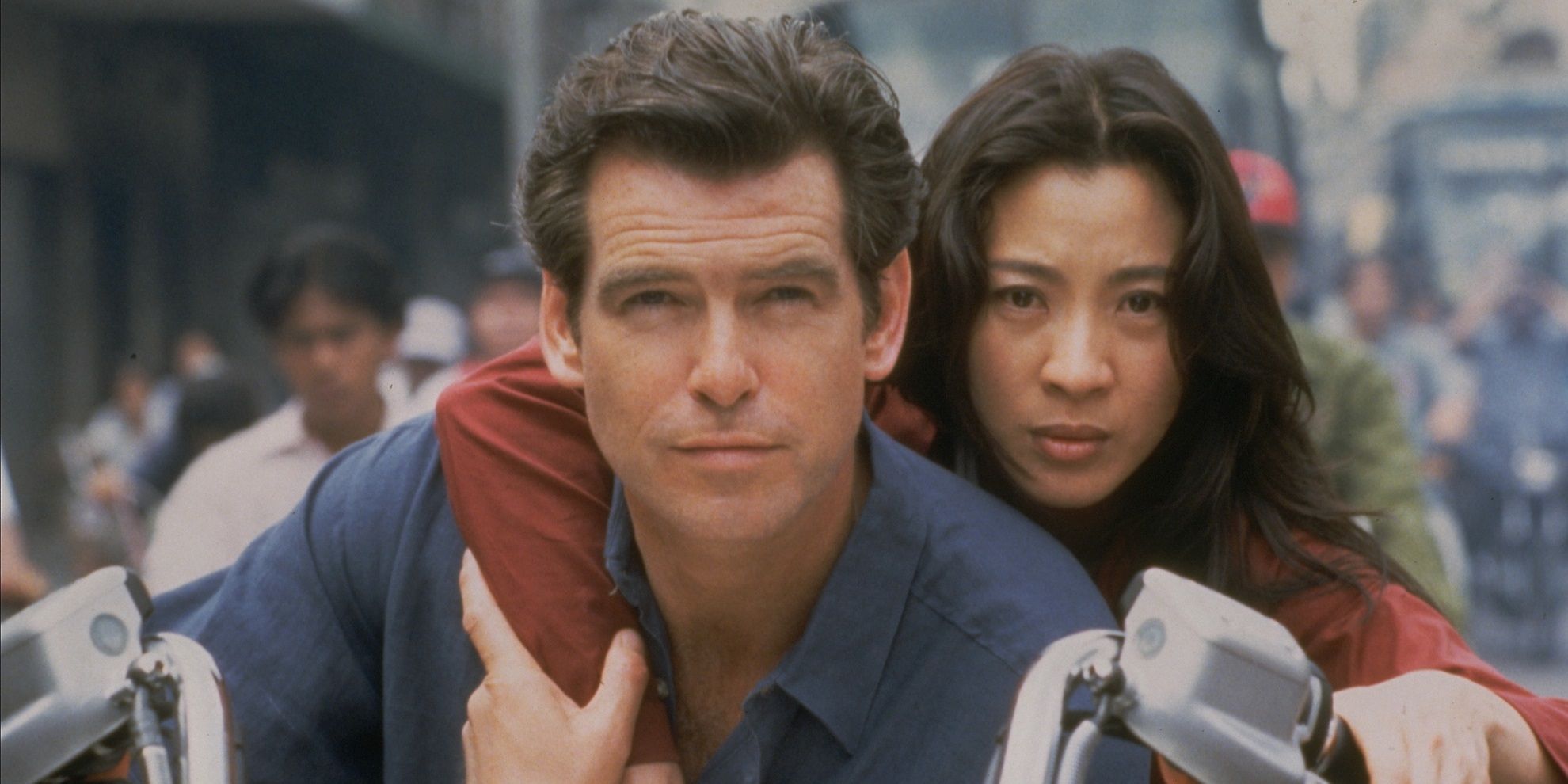 Pierce-Brosnan-and-Michelle-Yeoh-on-a-motorcycle-in-Tomorrow-Never-Dies-1