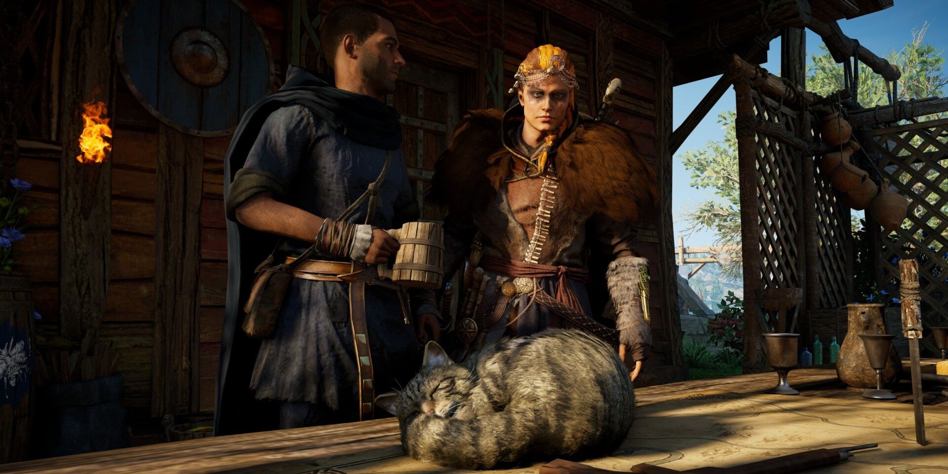 Pierre and Eivor looking at a cat in Assassin's Creed Valhalla.