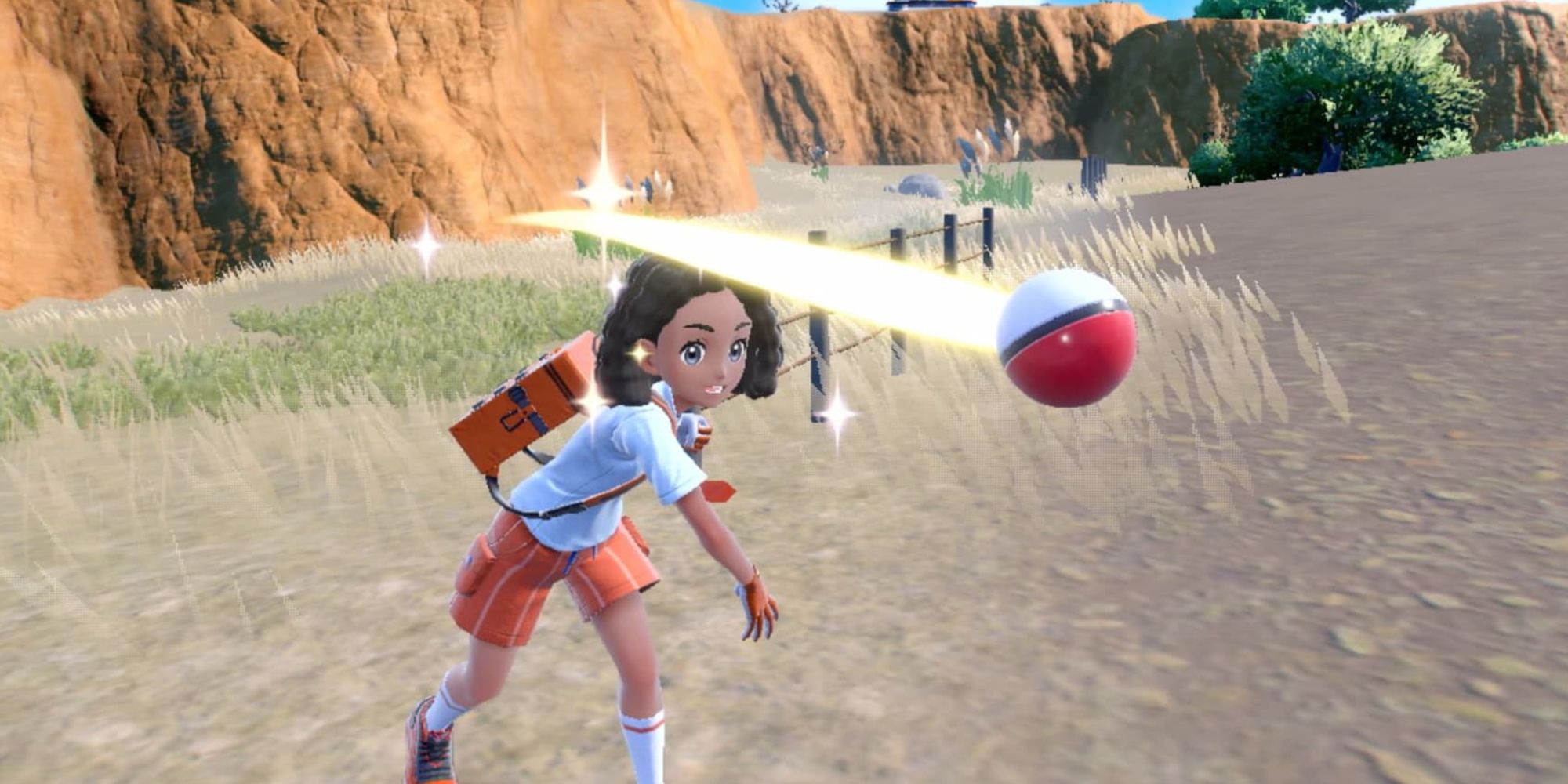 A trainer throwing a Poke Ball in Pokemon Scarlet and Violet.