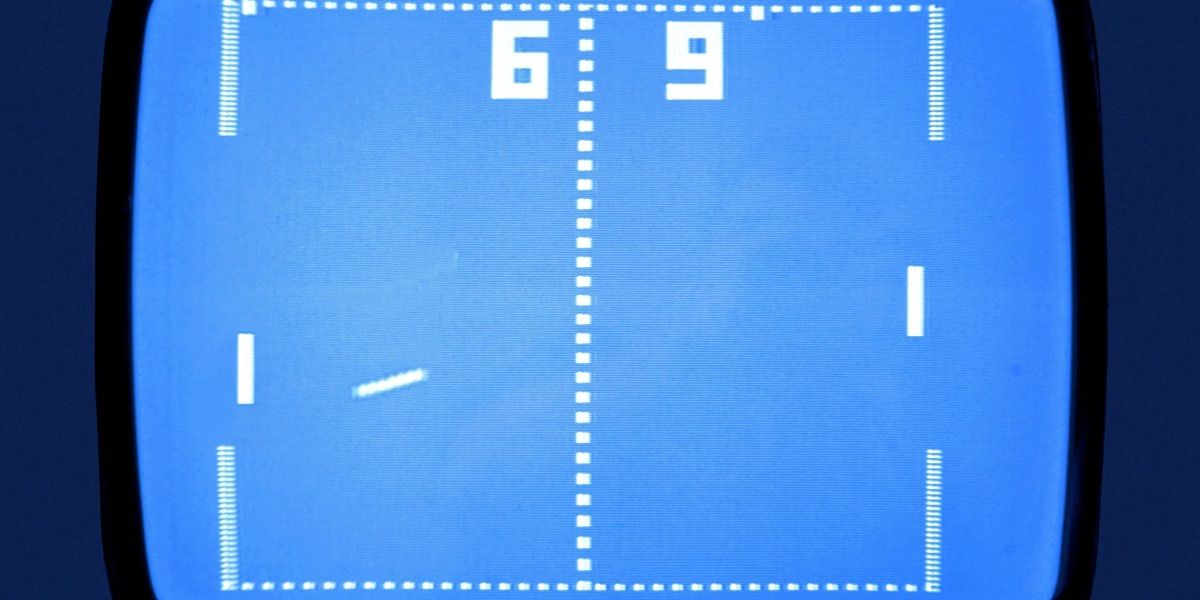 The ball flies across a blue screen in the Atari Pong game