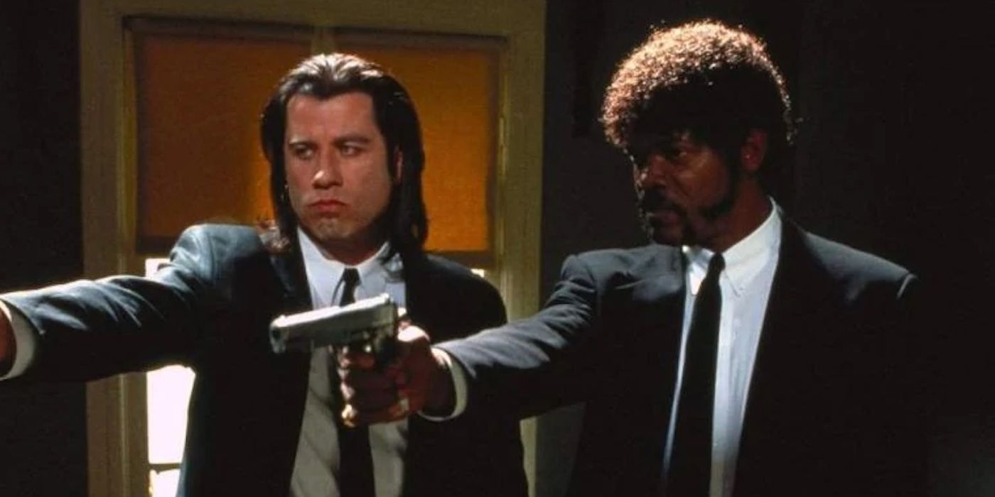 John Travolta and Samuel L Jaskon as Vincent and Jules in Pulp Fiction pointing their guns