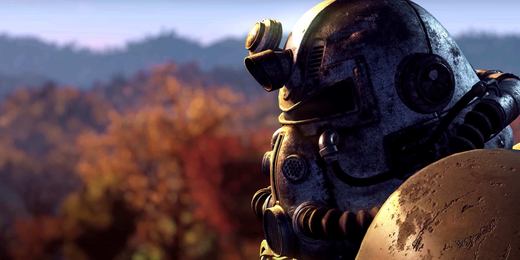 A cinematic screenshot of power armor in Fallout 76's Official Trailer with a forest background.