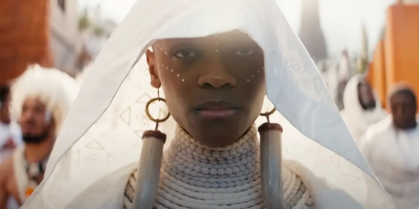 Shuri wearing a ceremonial gown at T'Challa's funeral in Black Panther: Wakanda Forever