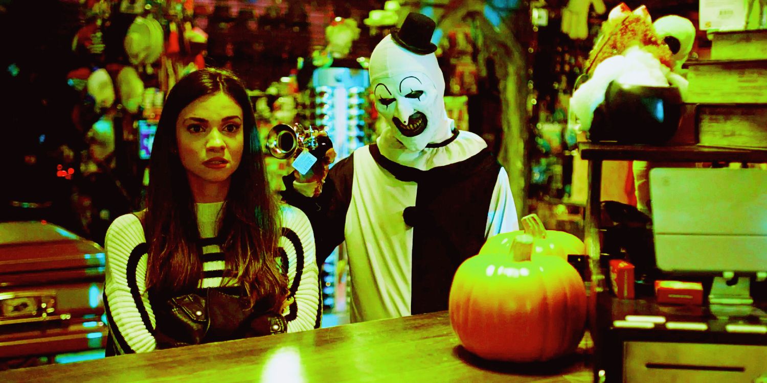 Sienna-Next-To-Art-The-Clown-In-Halloween-Store-Terrifier-2