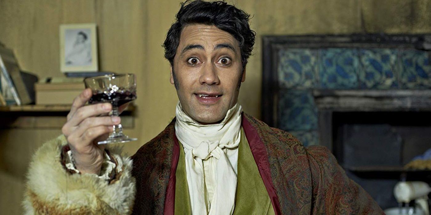 Taika Waititi with a glass of blood in What We Do in the Shadows