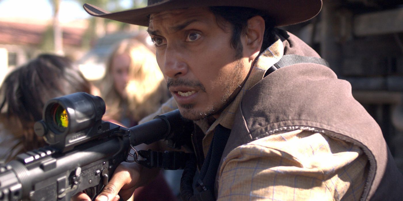 Tenoch Huerta holding a gun in The Forever Purge