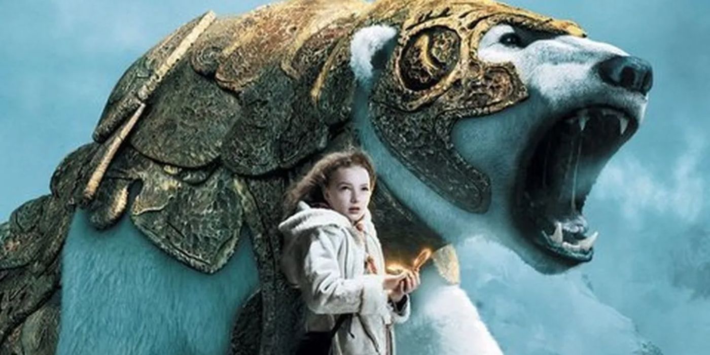 Lyra holding the golden compass in front of a giant polar bear in golden armor in The Golden Compass. 