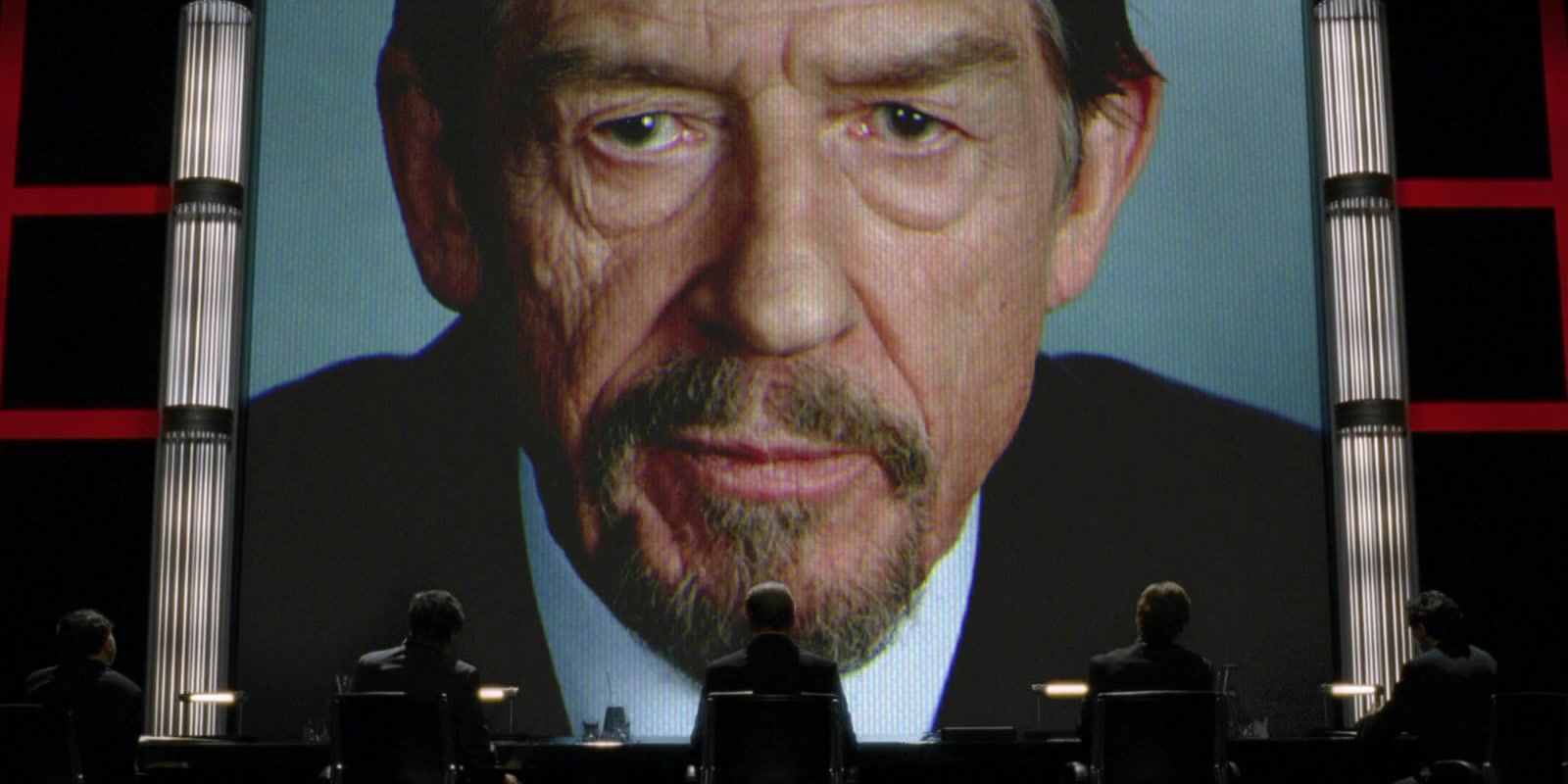 Adam Suttler (John Hurt) speaking from a large video screen in V for Vendetta.