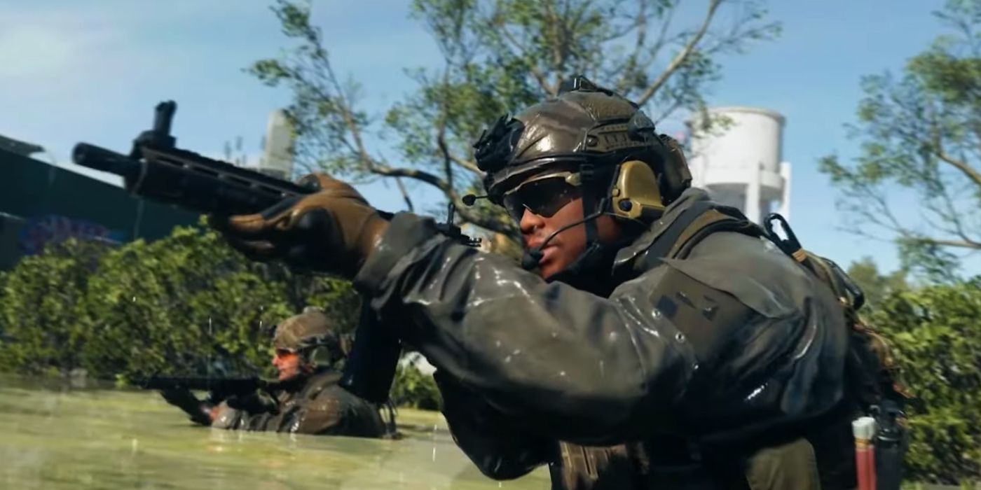 Two operators in Warzone 2 emerging from water, carrying assault rifles.