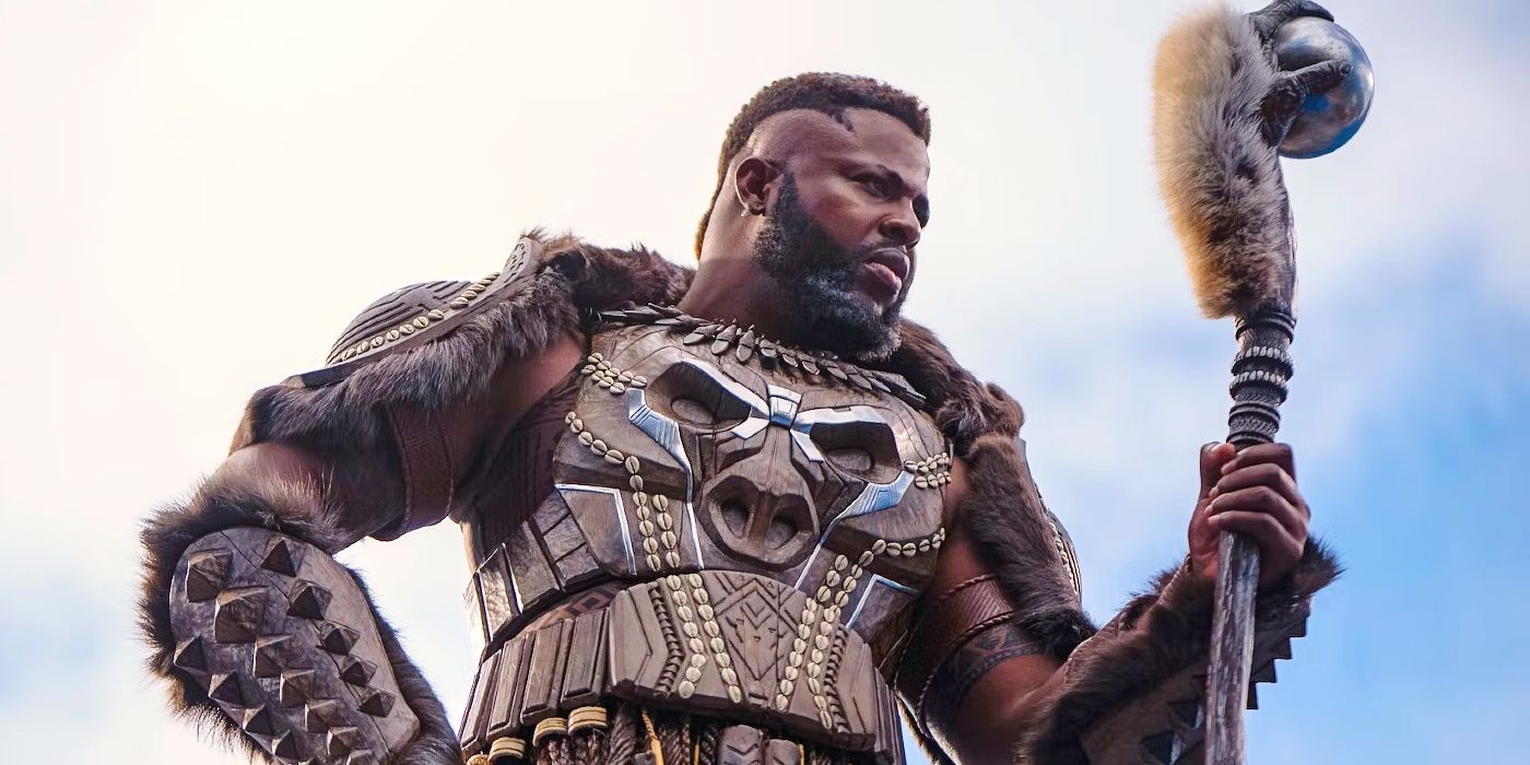 Winston Duke as M'Baku holding a staff in Black Panther: Wakanda Forever.