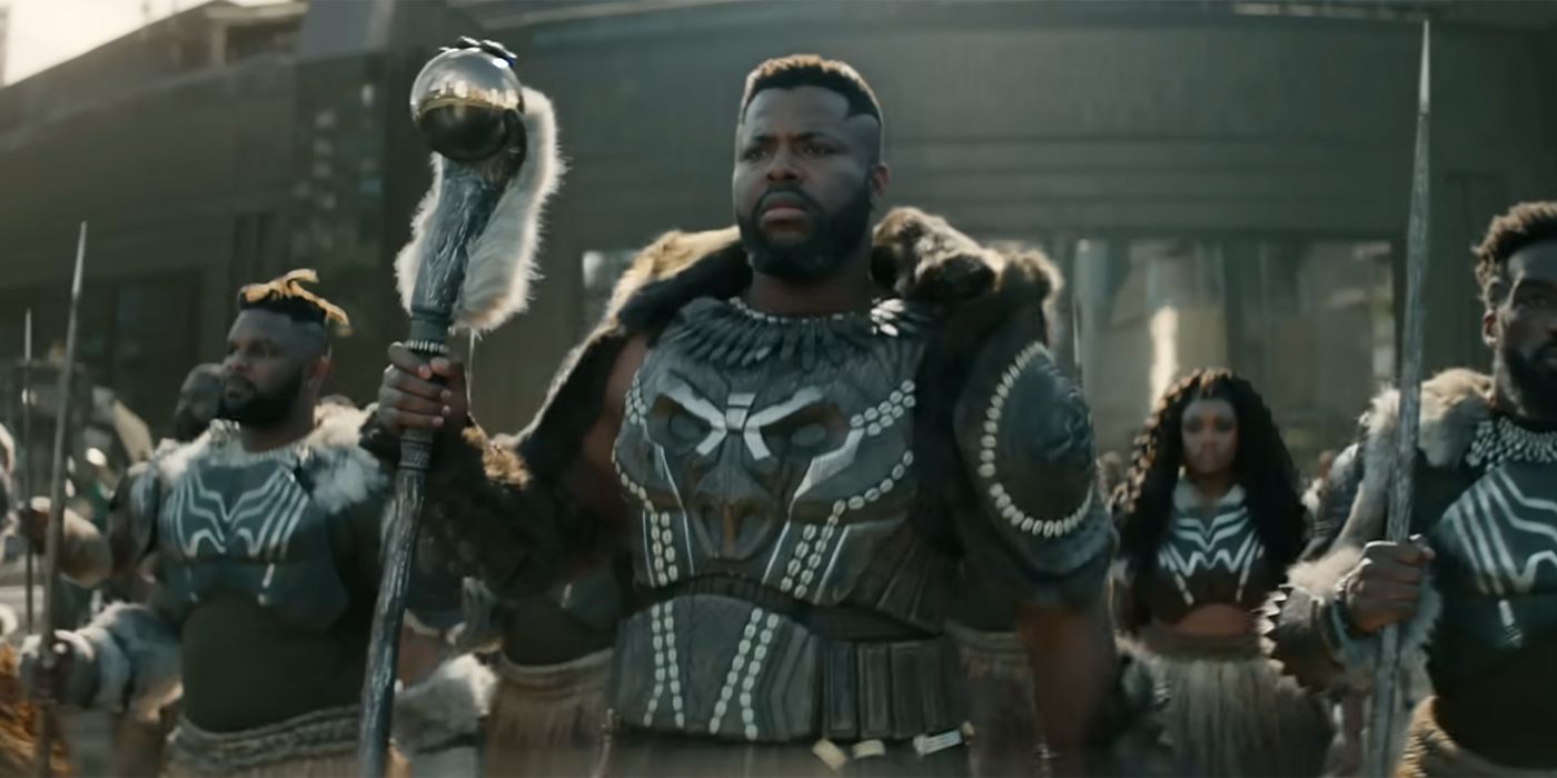 Winston Duke as M'Baku holding his staff in Black Panther: Wakanda Forever.