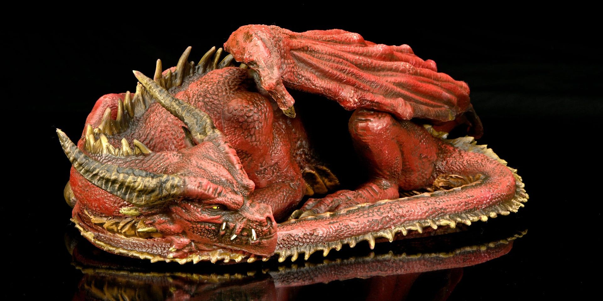 An image of WizKids' life-size pseudodragon figure against a black background