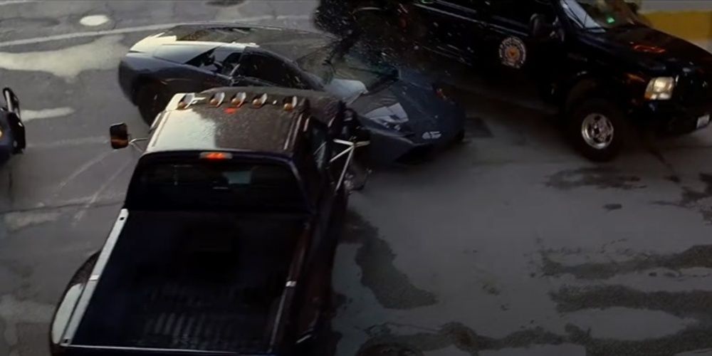 A car crashes into another in the street in THe Dark Knight 